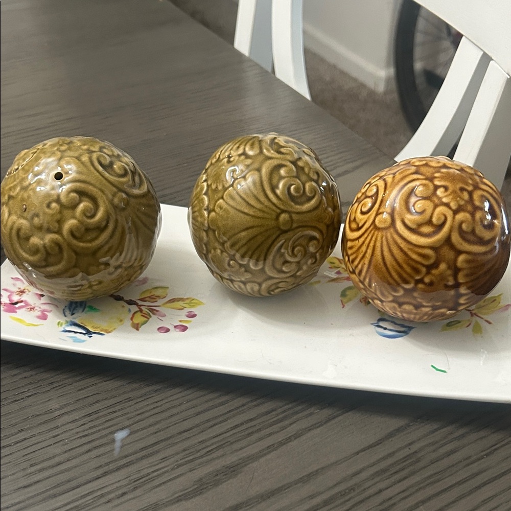 Ornate Ceramic Spheres in Earthy Tones